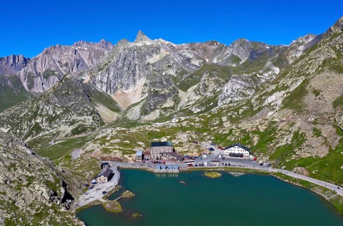 View from the Great St. Bernard Pass over the mountain lake Lac du Grand-St-Bernard to the Italian Alps with the peak Pain de Sucre in Italy