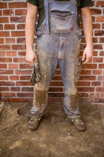Dirty and tattered dungarees of a construction worker. Berlin
