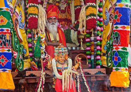 Priest Arumugam Paskaran at the main festival day during the big procession Theer