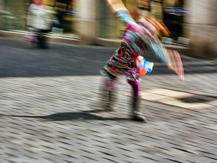 Colourful clown doing a cartwheel
