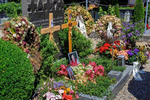 Fresh graves with wreaths and floral decorations