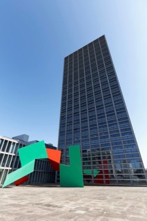 Sculpture She-Changes by American artist Janet Echelman in front of the Burgo Tower