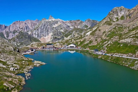 View from the Great St. Bernard Pass over the mountain lake Lac du Grand-St-Bernard to the Italian Alps with the peak Pain de Sucre in Italy