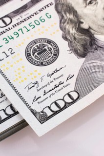 American 100 dollar banknotes made of paper placed on white background