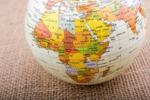 Globe placed on a brown fabric background