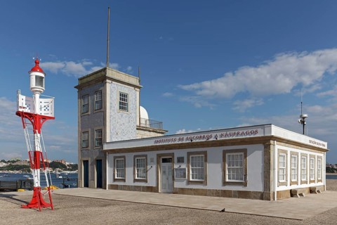 Historic lighthouse of Sao Miguel-O-Anjo and building of the Portuguese rescue organisation Instituto de Socorro a Naufragos