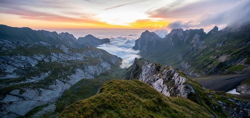View over Saentis mountains into the valley of Meglisalp at sunrise