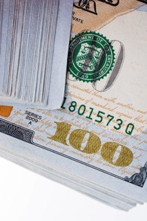 American 100 dollar banknotes made of paper placed on white background