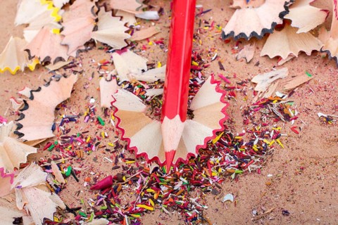 Red Color Pencil over some pencil shavings