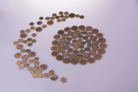 Turkish Lira coins shape a crescent round a circle object on white background