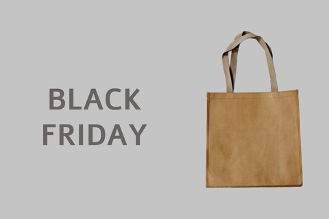 Black Friday. Luxury shopping bag on grey background. It can be use as a template