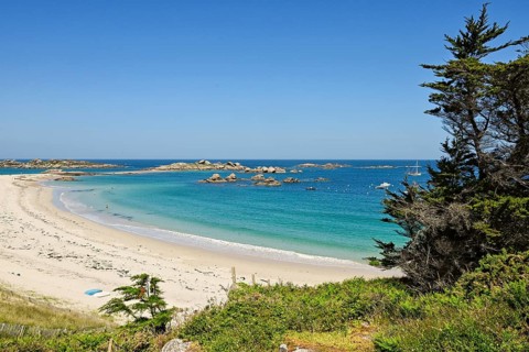Bay with sandy beach and granite rocks
