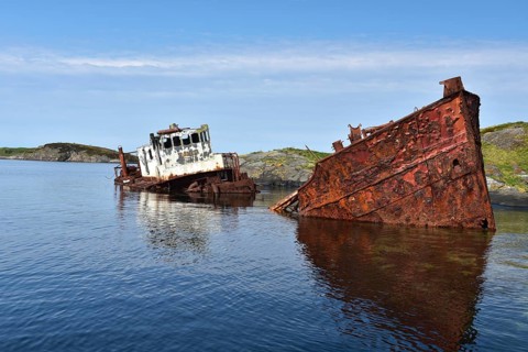 Rusty shipwreck on the Atlantic Strait in Norway