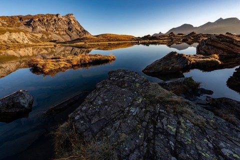 The Blue Lake at sunrise near Melchsee-Frutt on the Aa Alp in the Melch Valley