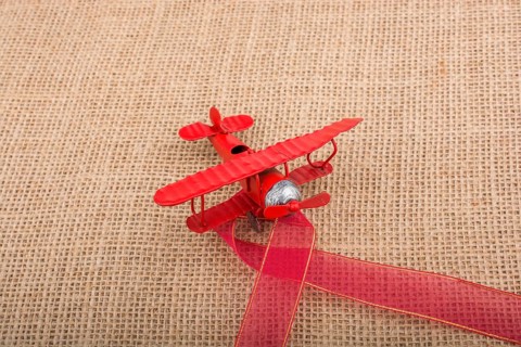 Toy airplane on a linen canvas background