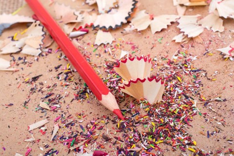 Red Color Pencil over some pencil shavings
