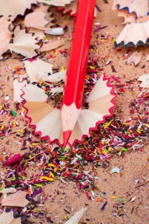 Red Color Pencil over some pencil shavings