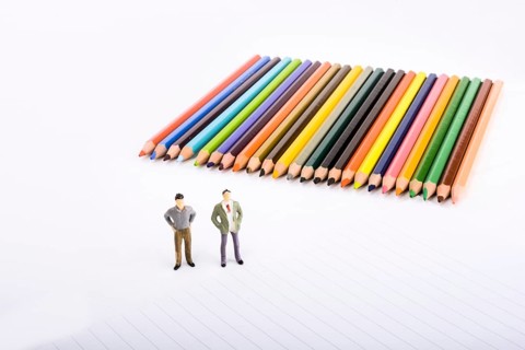 Two figurine standing by pen