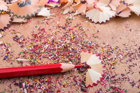 Red Color Pencil over some pencil shavings