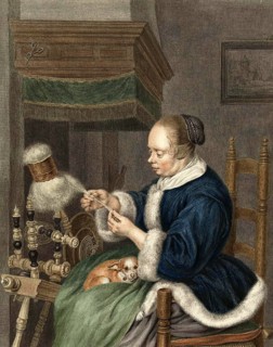 Woman spinning yarn at the reel
