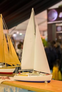 Mini size little colorful model sailboat in view