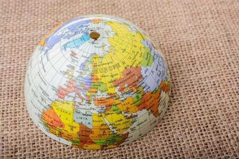 Globe placed on a brown fabric background