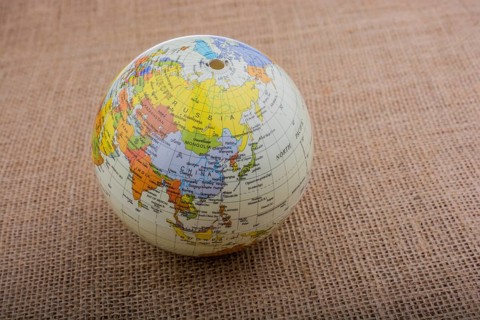 Globe placed on a brown fabric background
