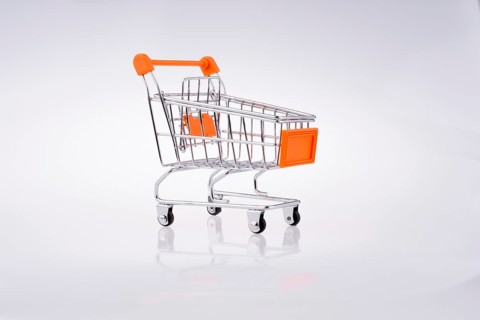 Hand holding a Cart on a white background