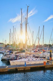 Lisbon marina on Tagus river with moored yachts and boats on sunset. Belem