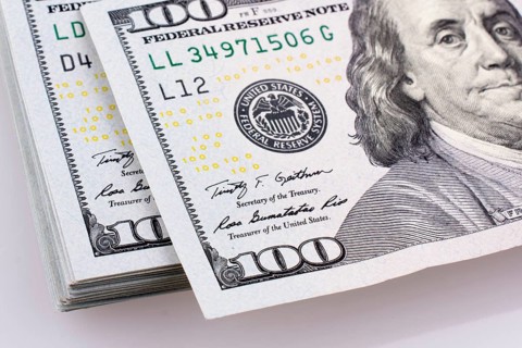 American 100 dollar banknotes made of paper placed on white background