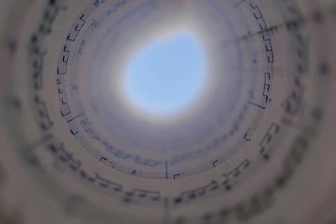 Spiral score forming a circle with a black background