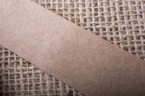 Piece of note paper placed on a linen canvas