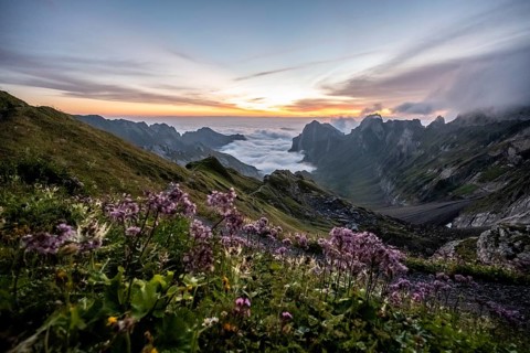 View over Saentis mountains into the valley of Meglisalp at sunrise