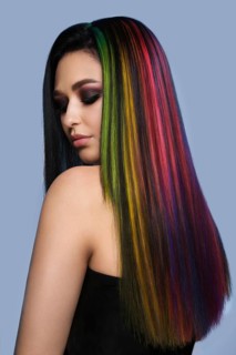 Portrait of beautiful woman with multi-colored hair and creative make up and hairstyle
