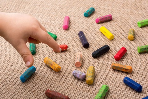 Used color crayons and a toddlers hand pointing