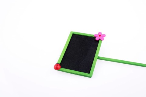Green framed signboards with a flower and ladybug on a white background