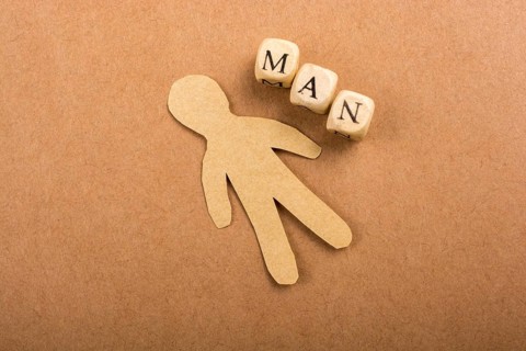 Paper man and man wording with letter cubes on paper