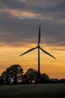 Wind power plant in front of evening sky