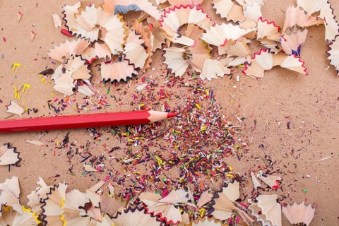 Red Color Pencil over some pencil shavings