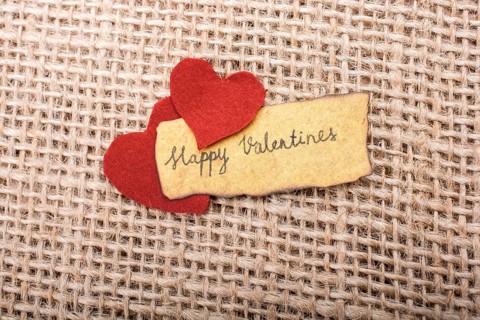 Love icon and Valentine's day wording on torn paper