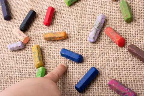 Used color crayons and a toddlers hand pointing