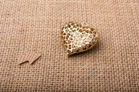 Heart shaped object with an arrow on canvas