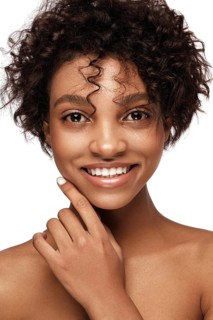 African American skincare models with perfect skin and curly hair. Beauty spa treatment concept