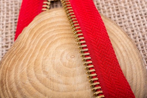 Closeup of a colorful zipper with metal teeth