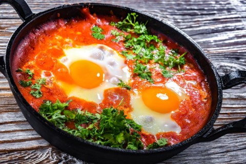 Shakshouka dish in a cast iron pan