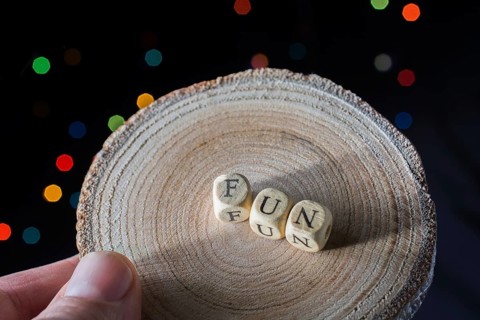 Fun wording in hand cubes bokeh lighton a dark background