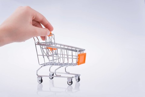 Hand holding a Cart on a white background