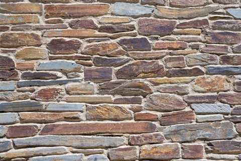 Slate slabs stacked to form a house wall
