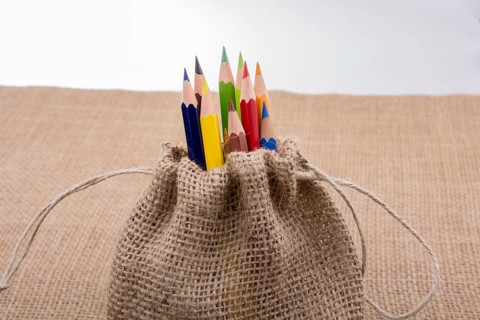 Color Pencils in a linen sack on canvas