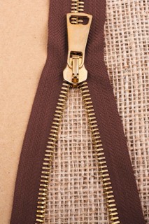 Closeup of a colorful zipper on linen canvas